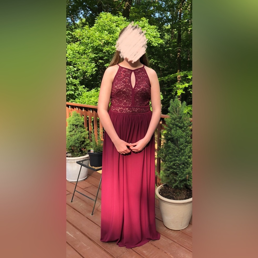 Burgundy sequin keyhole sleeveless formal dress.